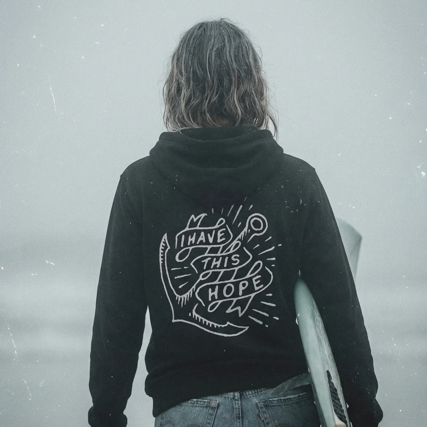 Surfer wearing a Mangrove I Have This Hope hoodie