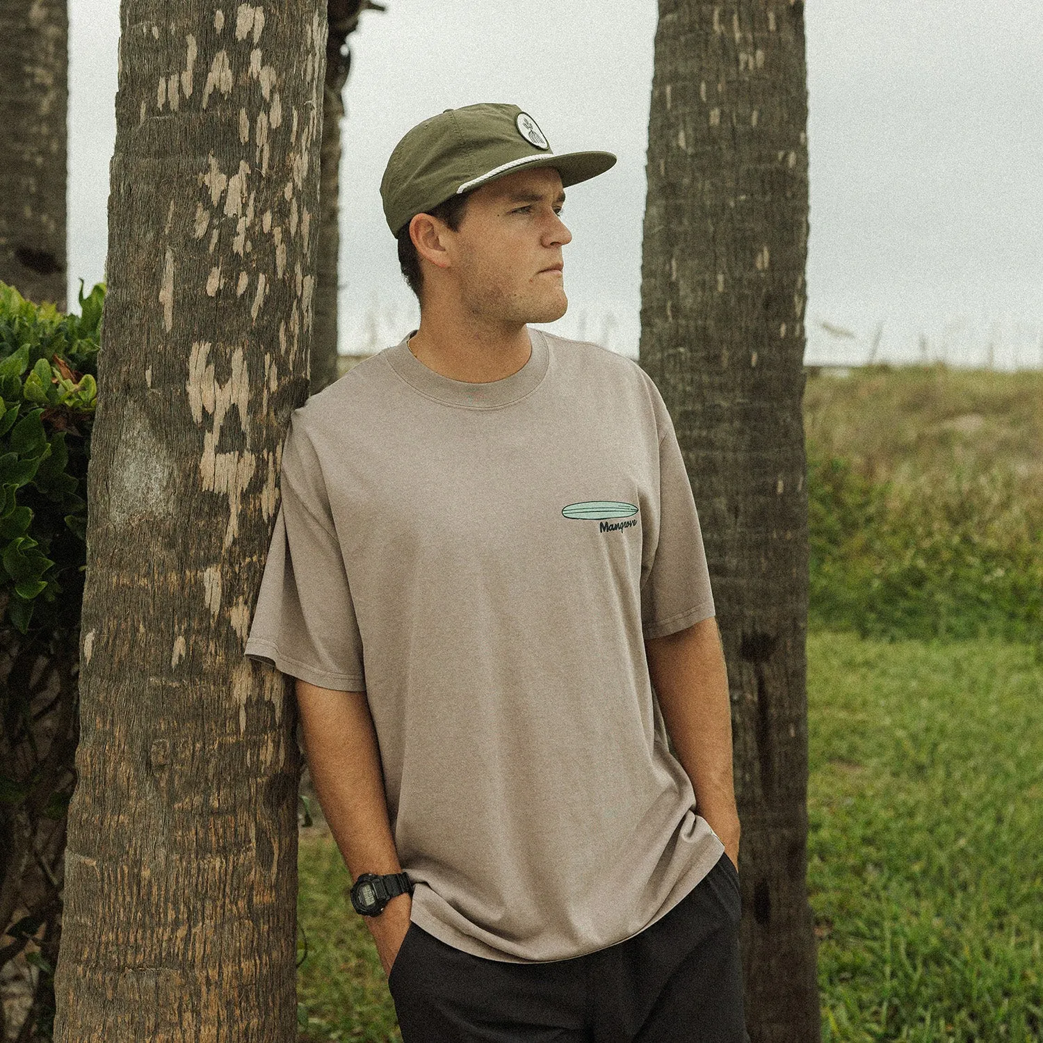 Mangrove shirt photographed among palms near the beach